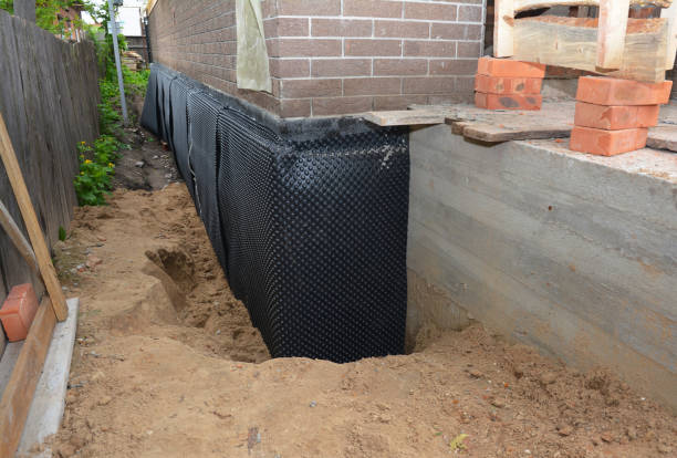 Happy homeowners after waterproofing job in Bessemer